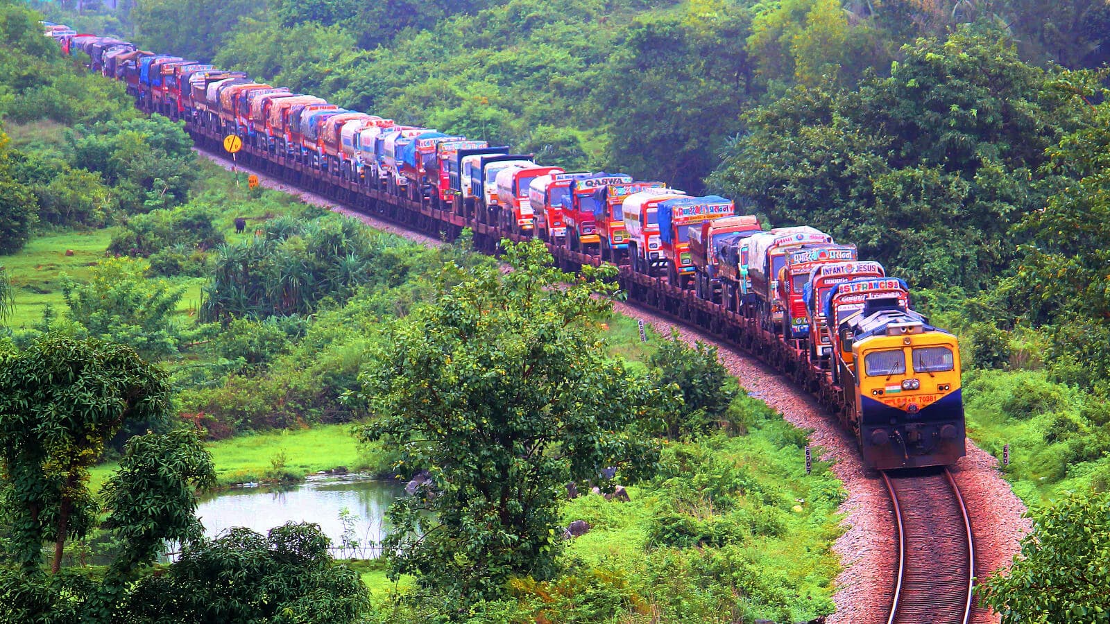 Cargo train crossing a majestic bridge